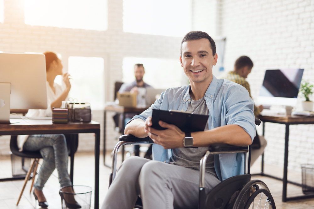 Disabled,Person,In,The,Wheelchair,Works,In,The,Office.,He